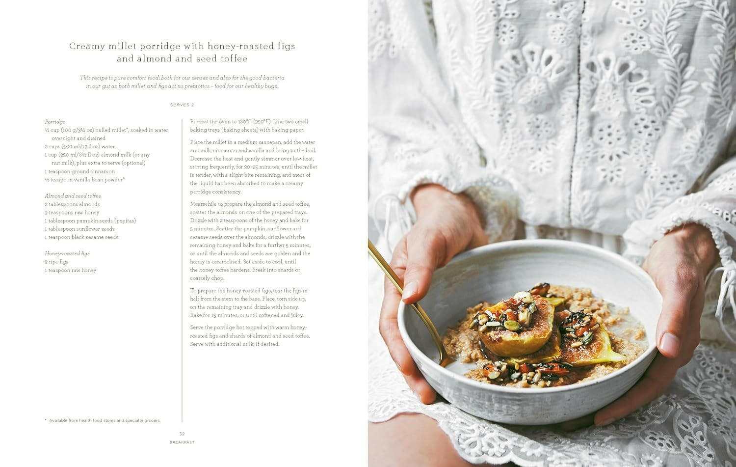 Person holding a bowl of creamy millet porridge with honey-roasted figs and almond seed toffee from The Beauty Chef cookbook.