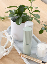 norsu STUDIO Marble Long Tray Calacatta with plant, candle, and decor accessories on wooden surface