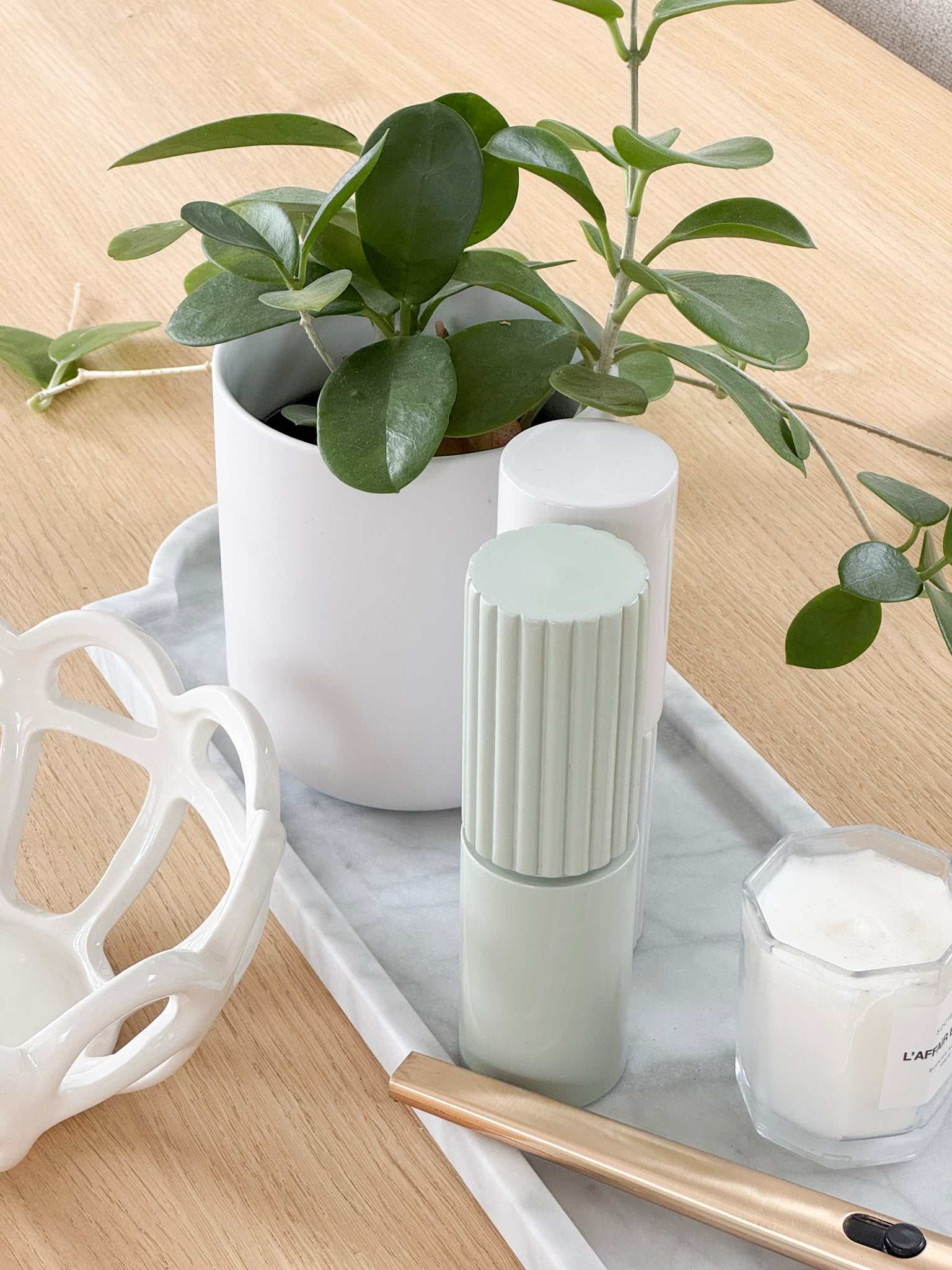 norsu STUDIO Marble Long Tray Calacatta with plant, candle, and decor accessories on wooden surface