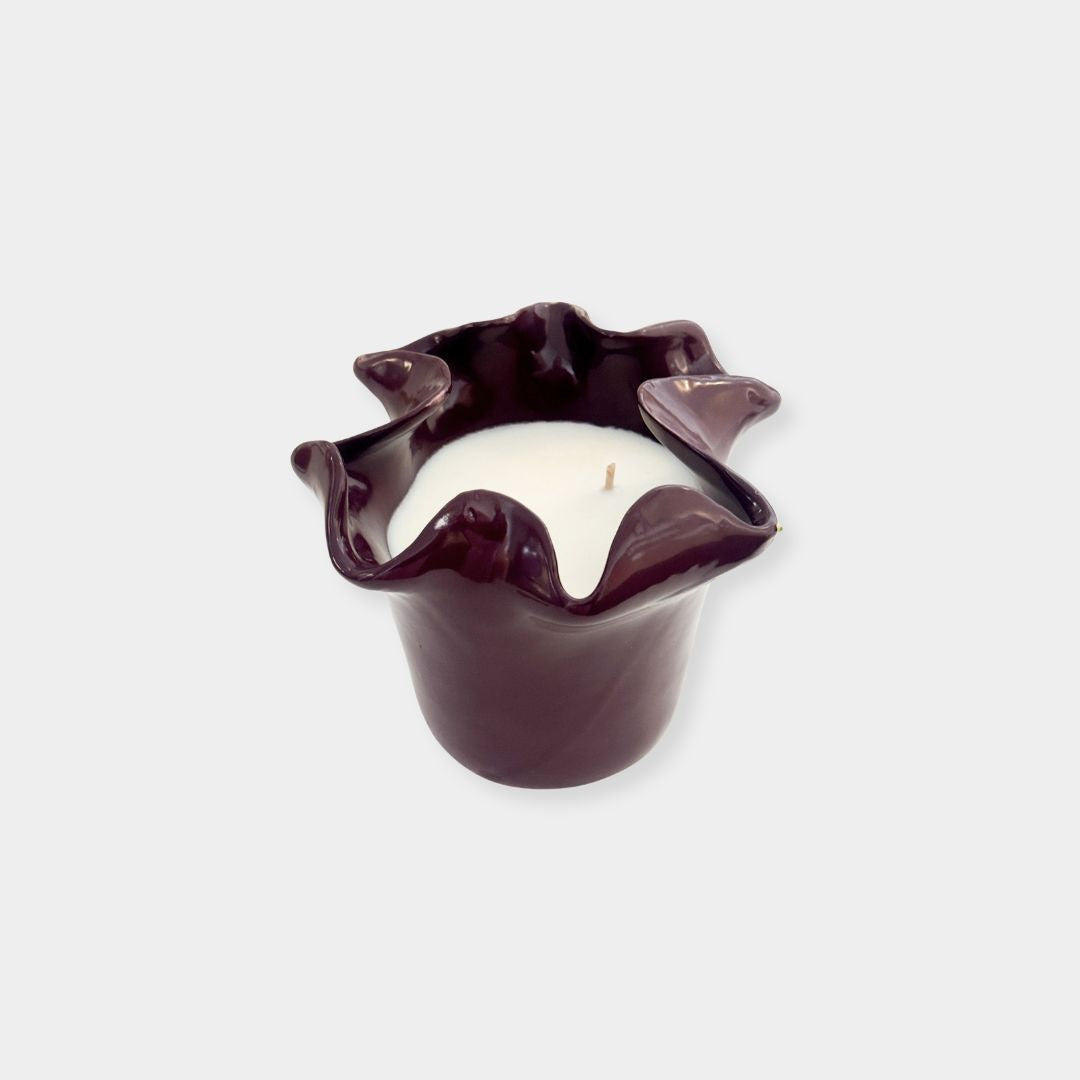 norsu Studio Flow burgundy sculptural ceramic scented candle with ruffled edge and Antibes fragrance