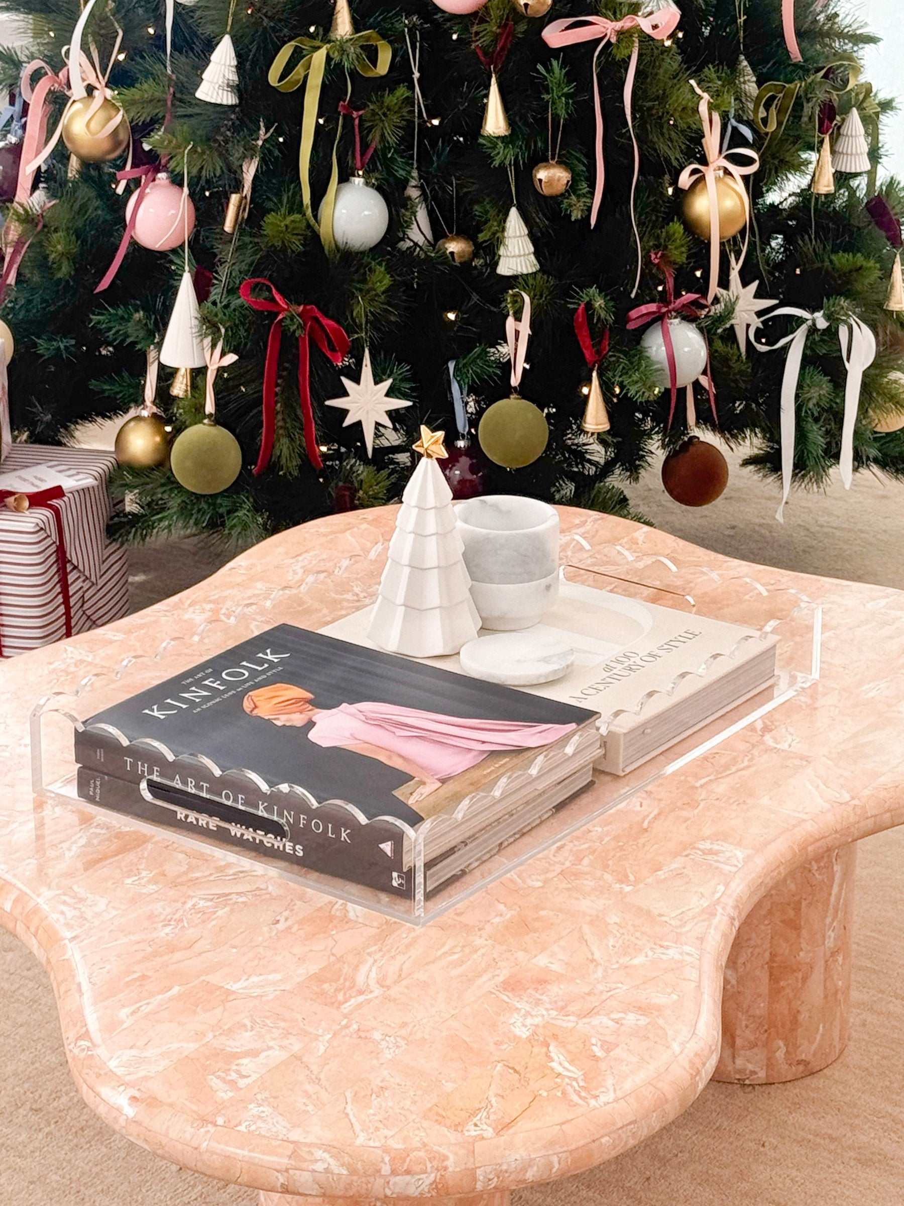 norsu STUDIO flocked velvet Christmas baubles in pickle green with nude ribbons hanging on tree in festive setting