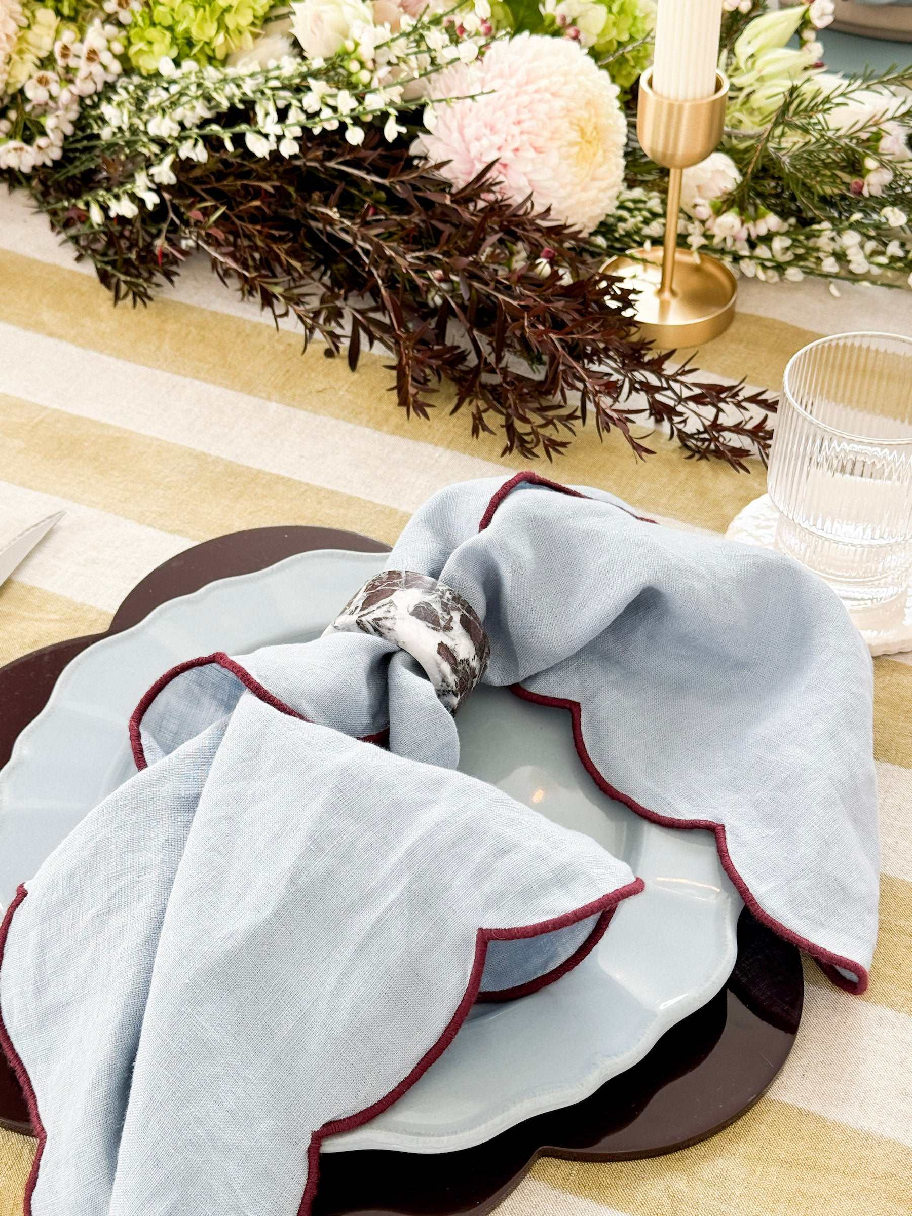 norsu STUDIO scalloped burgundy placemats set of 4 with hand-lacquered finish on table setting