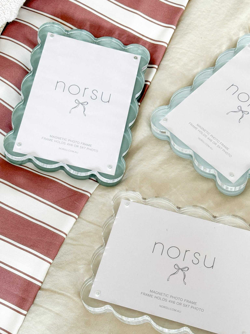norsu Studio scalloped magnetic photo frames with blue background and acrylic finish for easy photo swapping