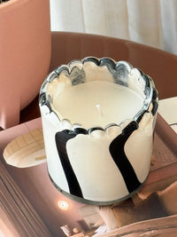 Ella Glass Candle in ivory and black hand-painted glass vase with sculptural design and soothing scent