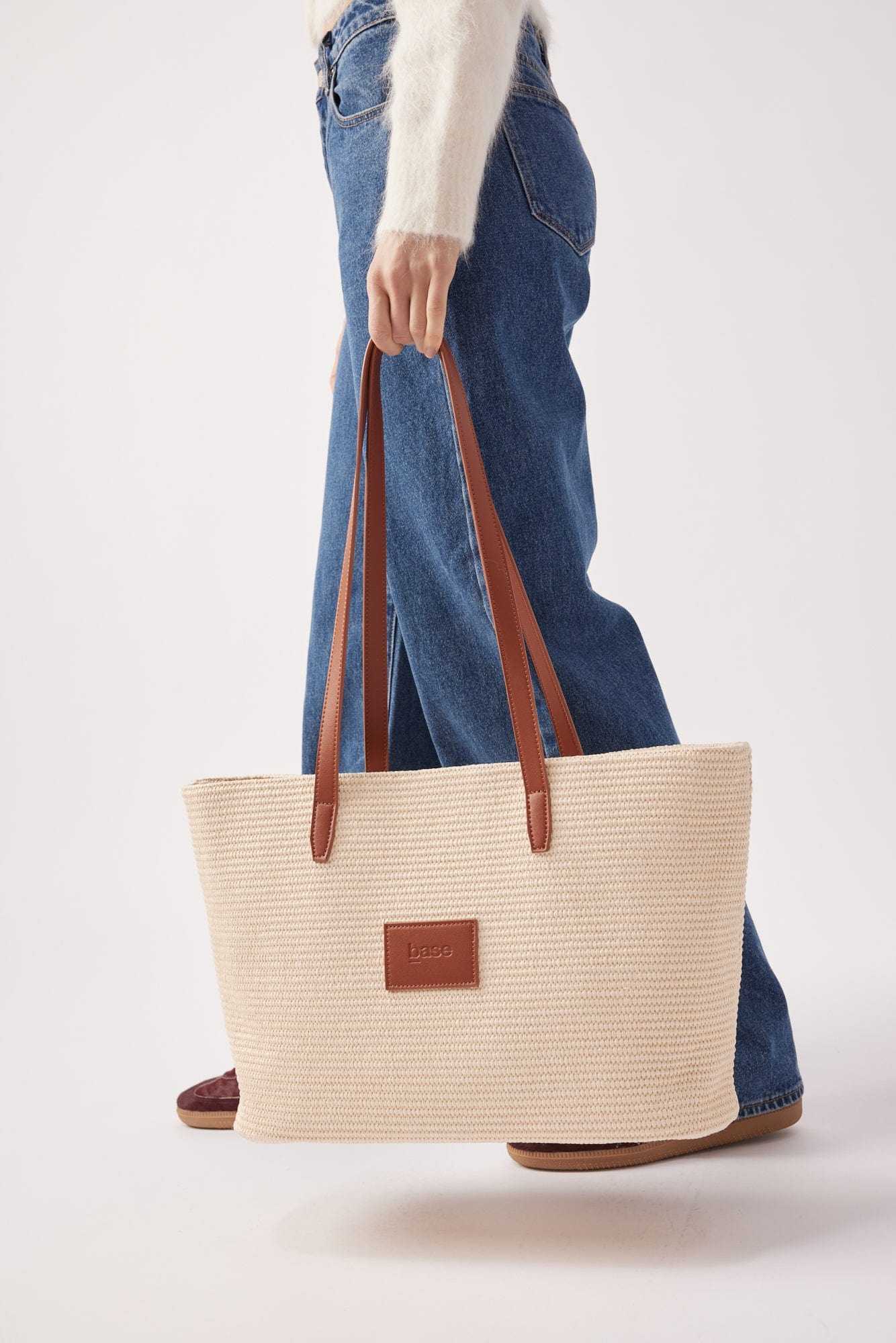 Base Supply Panier tan woven straw tote bag with leather straps and cotton lining