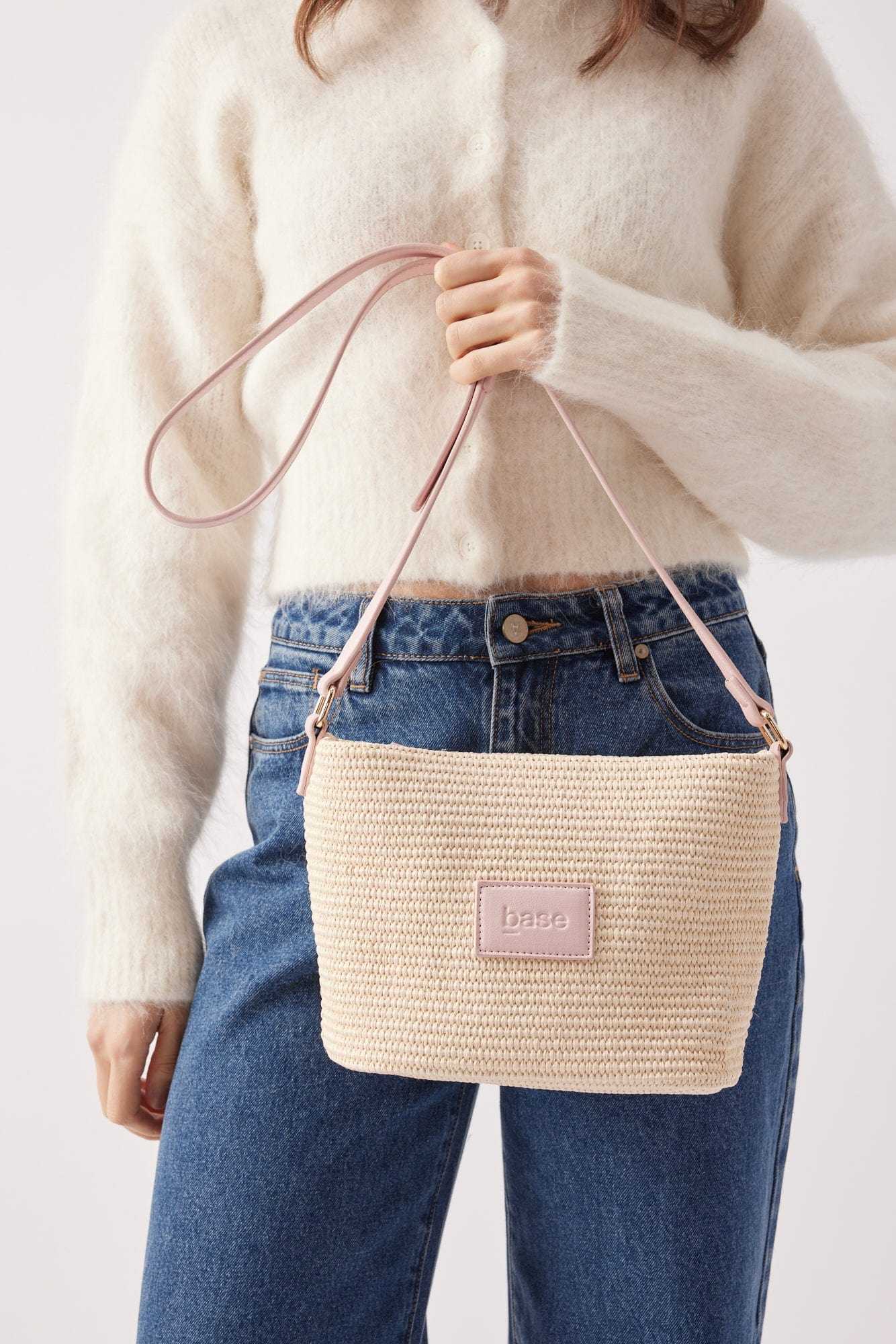 Base Supply Panier Crossbody pink woven straw bag with adjustable strap and cotton lining