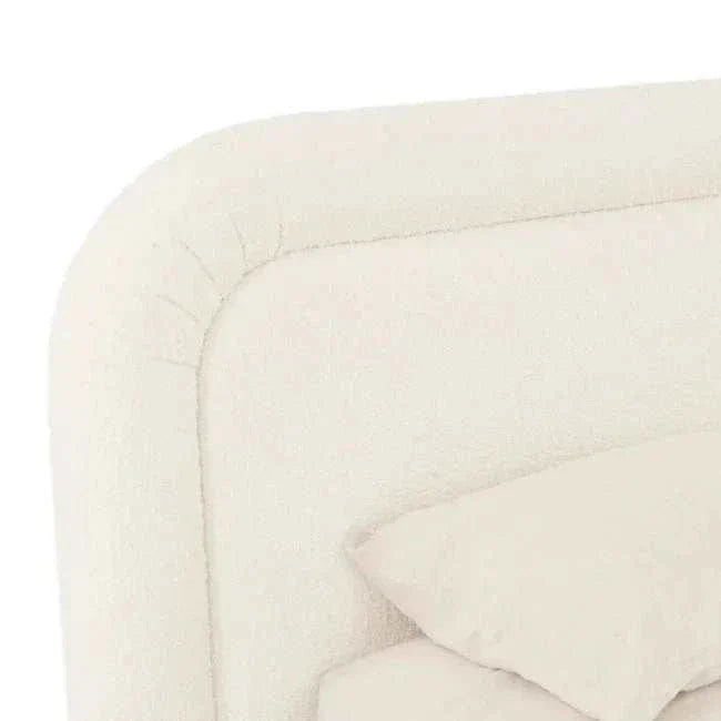Close-up of the GlobeWest Almos Chubby Bed in king size, featuring ivory boucle fabric and thick tubular upholstered headboard and frame.