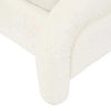 Close-up of the ivory boucle leg detail on the GlobeWest Almos Chubby Bed king size frame