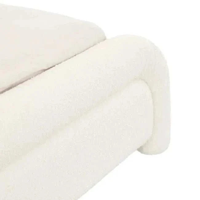 Close-up of Ivory Boucle upholstered Almos Chubby Bed corner with thick tubular curved design and soft texture.