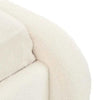 Ivory boucle fabric close-up of GlobeWest Almos Chubby Bed king size upholstery and tubular curved design