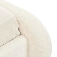 Ivory boucle fabric close-up of GlobeWest Almos Chubby Bed king size upholstery and tubular curved design