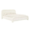 Ivory boucle upholstered GlobeWest Almos Chubby King bed with sculptural curved frame and fully upholstered legs.