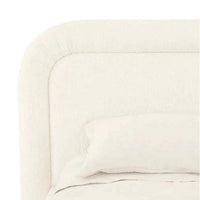 King size GlobeWest Almos Chubby Bed in ivory boucle fabric with thick tubular upholstered frame and sculptural curves.