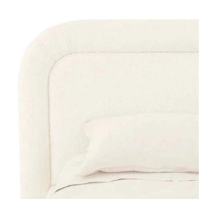 King size GlobeWest Almos Chubby Bed in ivory boucle fabric with thick tubular upholstered frame and sculptural curves.