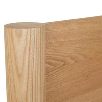 Close-up of Globe West Artie Bedhead in natural ash timber showing smooth grain and rounded corner detail