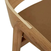Tolv Inlay Barstool close-up showing pecan leather seat and light oak solid wood frame detail