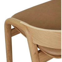 Close-up of Tolv Inlay Barstool showing pecan leather seat and light oak wooden frame