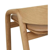 Close-up of GlobeWest Tolv Inlay Barstool in pecan leather and light oak timber frame