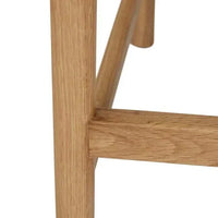 Close-up of Light Oak solid oak timber base on GlobeWest Tolv Inlay Barstool in Pecan leather upholstery