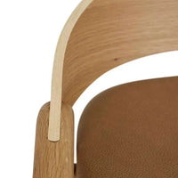 Close-up of GlobeWest Tolv Inlay Barstool showing pecan leather seat and light oak timber frame detail
