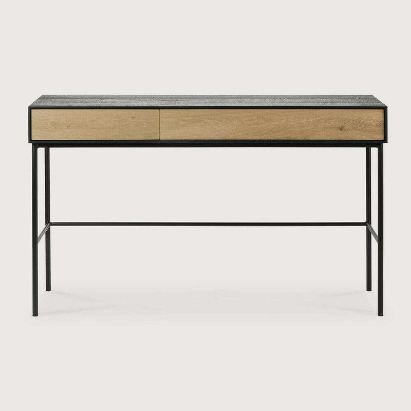 Ethnicraft Blackbird console desk with natural oak drawers and black metal frame, featuring soft-close drawers and modern design.
