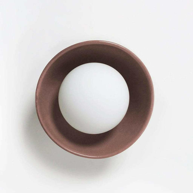norsu x Robert Gordon Bowl Sconce light in dusty rose ceramic with white spherical bulb