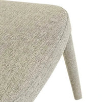 Close-up of Pebble Tweed upholstered seat and legs of the GlobeWest Jules Dining Chair showcasing its textured fabric and contemporary design.