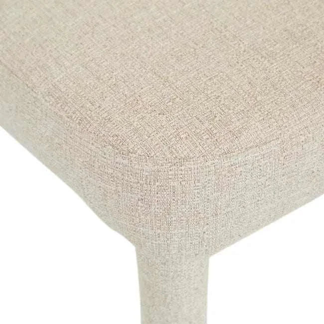 Close-up of GlobeWest Jules Dining Chair featuring Sandcastle Tweed textured fabric upholstery