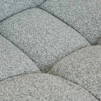 Close-up of GlobeWest Kip Occasional Chair upholstery in Nimbus grey with quilted texture and plush padding