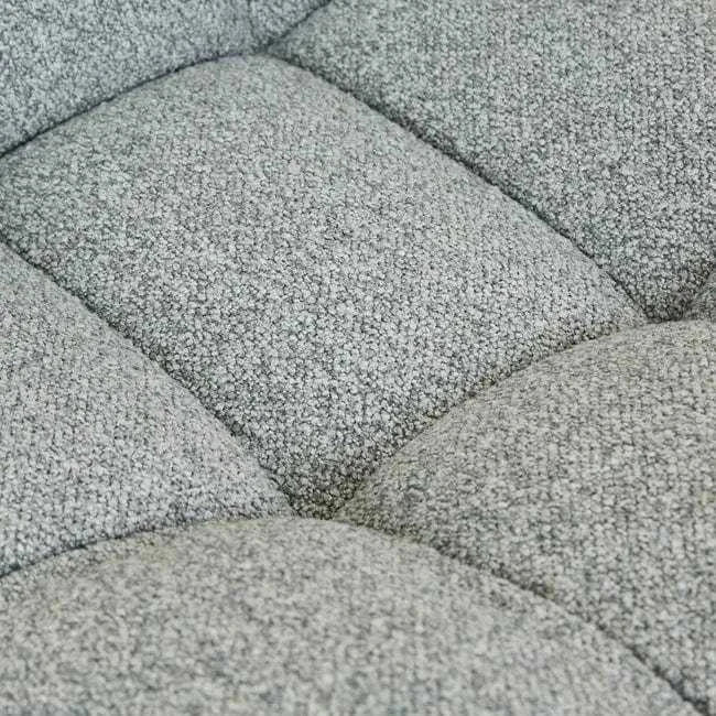 Close-up of GlobeWest Kip Occasional Chair upholstery in Nimbus grey with quilted texture and plush padding