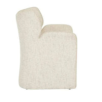 Side view of GlobeWest Ruben Occasional Chair upholstered in White Bark Sugar Velvet with winged back and contrast piping