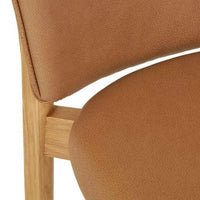 Close-up of GlobeWest Sketch Pinta Dining Chair featuring pecan leather upholstery and light oak wooden frame.