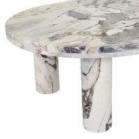 Globe West Amara oval coffee table with natural ocean marble and round legs in contemporary style