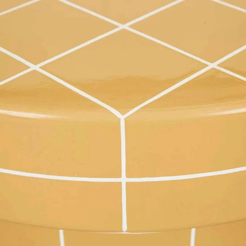 Close-up of GlobeWest Seville Tile round coffee table top in honey color with white grout lines