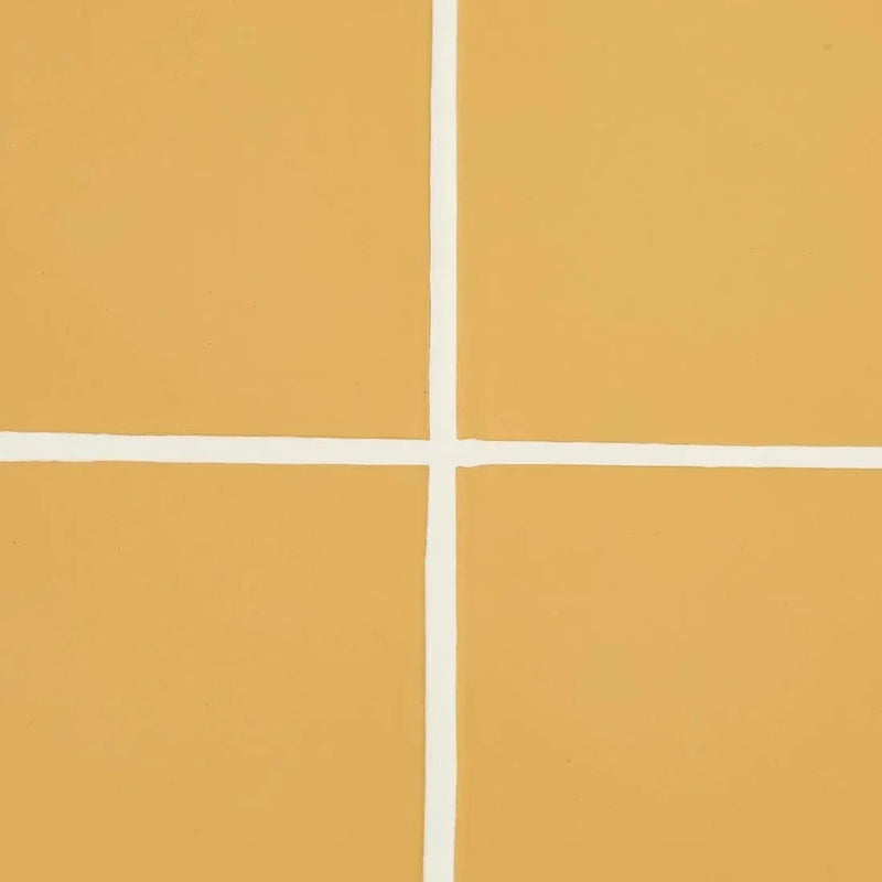 Close-up of honey-colored GlobeWest Seville Tile with white grout lines in a minimalist grid pattern