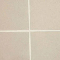 Close-up of pearl white tiled surface with crisp grout lines on GlobeWest Seville Tile round coffee table