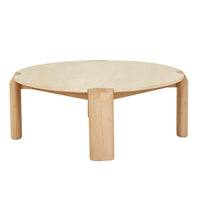 Willa Marble Coffee Table with natural travertine top and light oak ellipse-shaped leg in modern living room