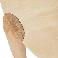 Willa Marble Coffee Table with natural travertine top and light oak elliptical legs in modern living room