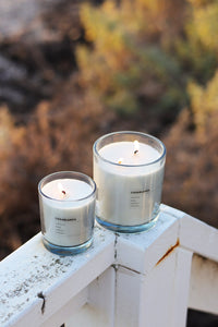 Grace and James Casablanca candles lit outdoors on a white rail