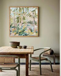 Marcia Priestley archival canvas print Catamaran County Pt 2 in floating oak frame hanging above rustic wooden dining table with woven chairs