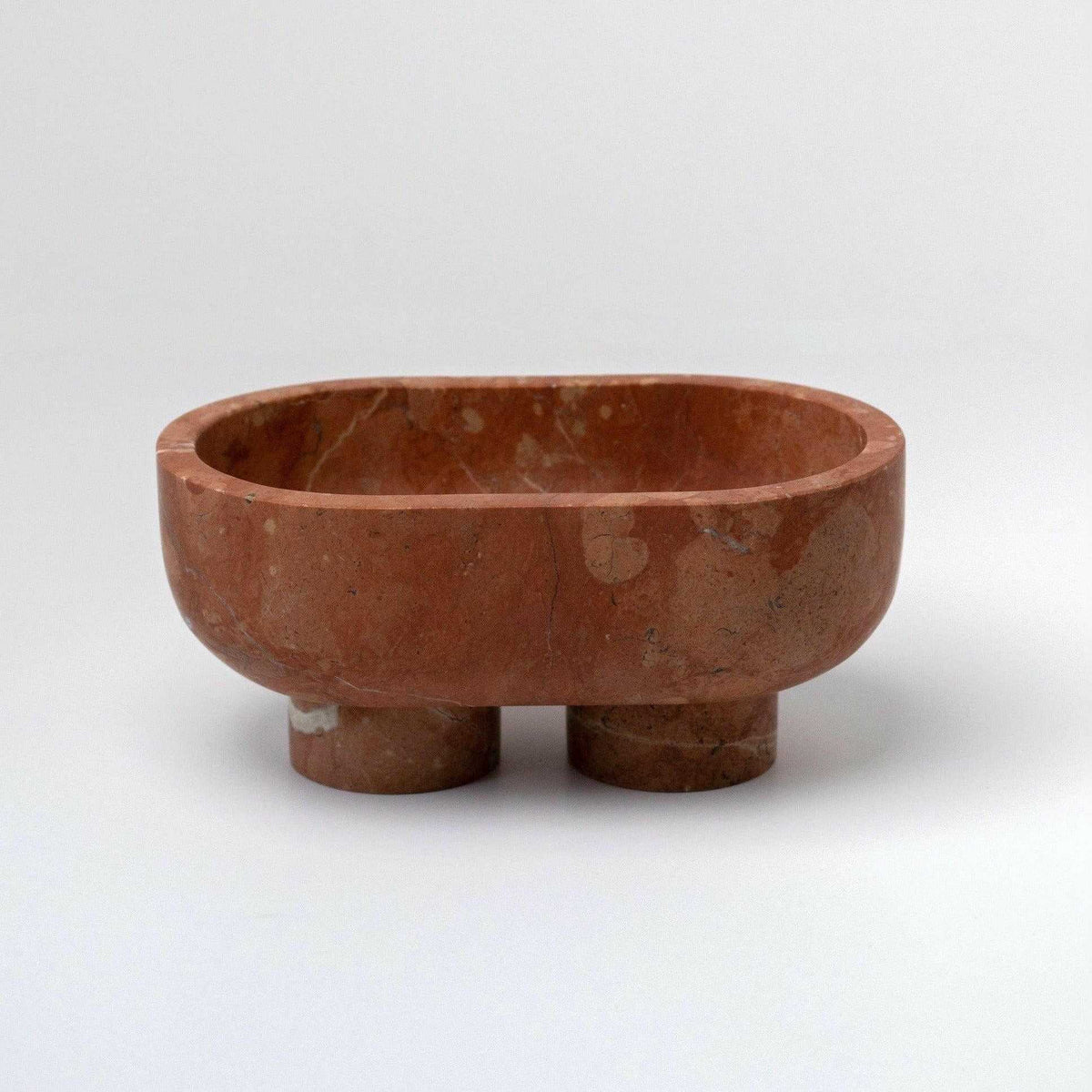 CoTheory Marble Footed Oval Tray in Rosso Alicante with sculptural stone design and unique organic patterns