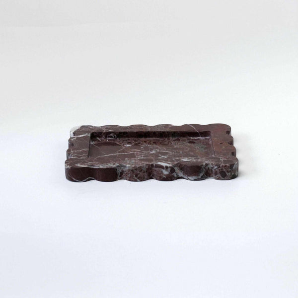 CoTheory small scalloped Rosso Levanto marble tray with intricate design and felt pads