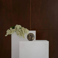 CoTheory Orbit Table Sculpture brown Emperador marble sphere symbolizing harmony and balance