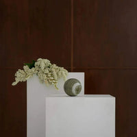 CoTheory Orbit Table Sculpture green marble sphere symbolizing harmony and balance
