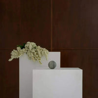 CoTheory Orbit Table Sculpture green marble sphere symbolizing harmony and balance