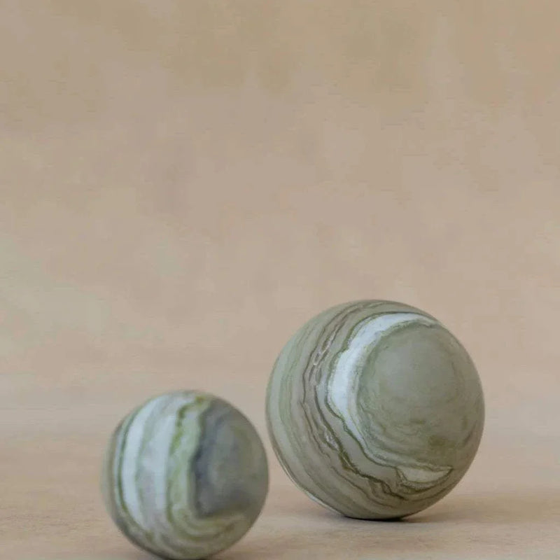CoTheory Orbit Table Sculpture green marble sphere symbolizing harmony and balance