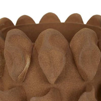 Close-up of textured flaxen porcelain Forme Hyacinth Vase with sculptural petal design