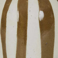 Close-up of GlobeWest Hanson Hako Small Vase featuring hand-applied sepia stripes on glazed earthenware ceramic surface.