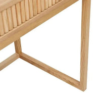 Close-up of the natural ash Globe West Benjamin Ripple Desk leg and ripple textured wood drawer front with geometric timber frame