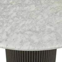 Close-up of Globe West Benjamin Ripple Marble Dining Table featuring white Carrara marble top and black ribbed ripple motif base